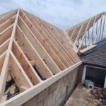 Timber roof extension with raised roof structure built by carpenters in Nottingham.