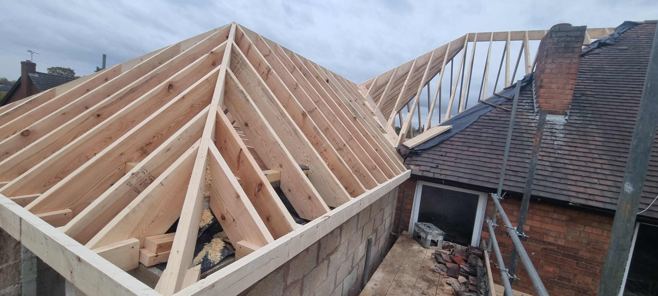 Timber roof extension with raised roof structure built by carpenters in Nottingham.