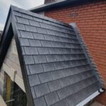 Timber roof frame for a house extension under construction by carpenters in Nottingham.