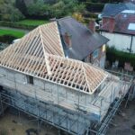 Timber roof frame renovation in progress on a residential house by carpenters in Nottingham.
